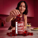 Hand holding a Renew NAD+ gummy