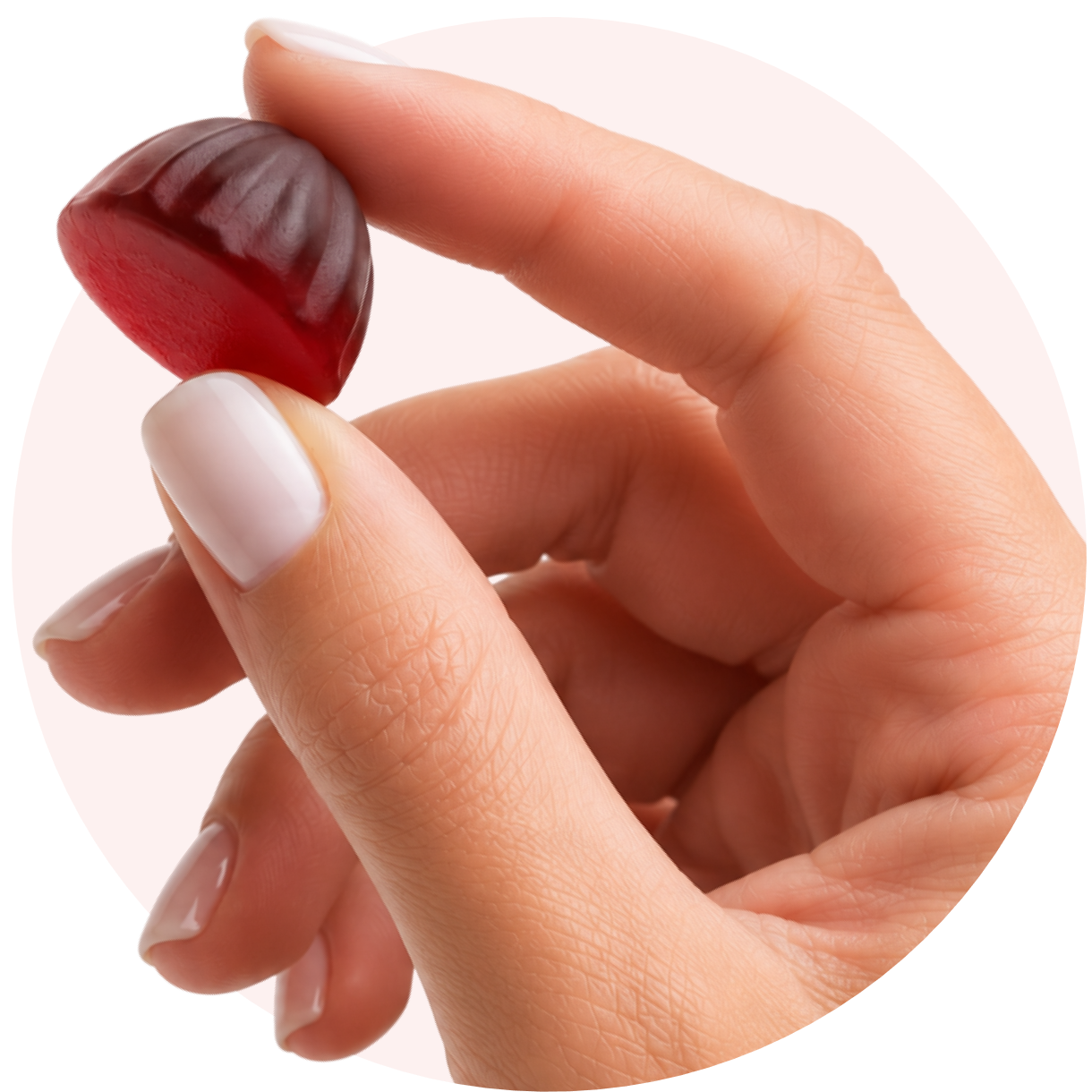 Holding a Goli Zero Sugar gummy