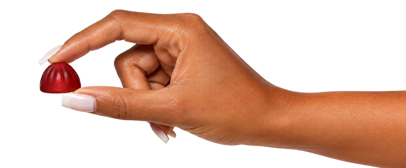 Holding a Goli Zero Sugar gummy